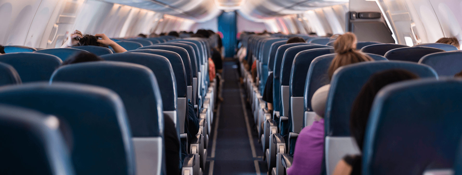 Rows of seats inside an airplane.
